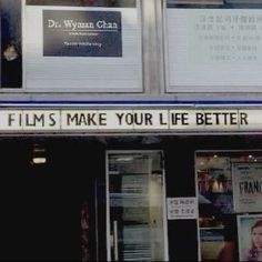 a building that has some signs on the front and side of it with words written in chinese