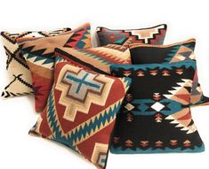 four colorful pillows with crosses on them, all in different colors and sizes are shown