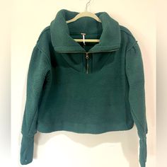 This Sweatshirt Is Adorable, It Has An Oversized Collar With A Half Zip In The Front. It’s Sherpa With Details On The End Of The Sleeve To Make It More Fitted. The Color Is Forest Pine And The Size Is A Small. This One Is New With Tags. Trendy Oversized Half-zip Top, Green Fleece Tops For Loungewear, Green Fleece Loungewear Top, Green Fleece Top For Loungewear, Green Half-zip Top, Green Fleece Half-zip Top, Green Comfy Tops For Fall, Cozy Fit Green Top For Fall, Trendy Half-zip Top With Ribbed Cuffs