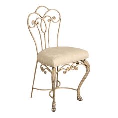 a white chair that is sitting up against a wall and has an ornate backrest