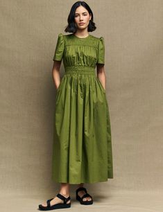 Olive Green Natalia Midi Dress | Nobody's Child Green Midi Dress With Fitted Bodice And Short Sleeve, Green Dress With Fitted Bodice For Casual Wear, Green Dress With Fitted Bodice For Casual Occasions, Green Sundress For Casual Occasions, Green Mid-length Dress Down, Green Short Sleeve Casual Dress, Green Cotton Midi Dress For Dress Down, Green Cotton Midi Dress For Casual Occasions, Green Mid-length Dress For Garden Party