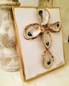 a cross made out of oysters on a card