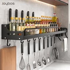 a rack with utensils hanging from it's side in front of a counter