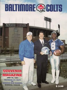 two men are holding footballs on the cover of baltimore sports magazine, with another man standing next to them