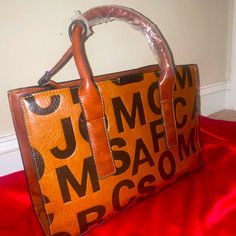 Brown Stylish Handbag , Brand New ! Casual Brown Satchel For On-the-go, Retro Brown Shoulder Bag For On-the-go, Trendy Cognac Shopping Bag, Trendy Brown Bags For On-the-go, Casual Brown Top Handle Satchel, Brown Shoulder Bag With Letter Print For Everyday Use, Brown Letter Print Shoulder Bag For Everyday Use, Trendy Brown Satchel With Double Handle, Brown Satchel With Leather Handles For Shopping