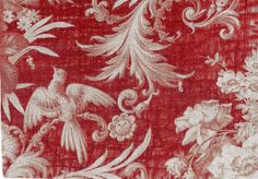 an old red and white wallpaper with birds, flowers and vines on it's side