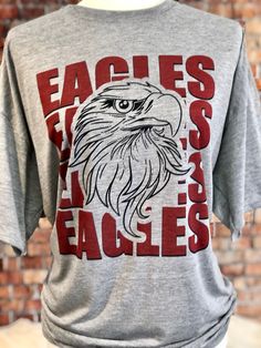 Treat yourself or anyone in your life to this awesome School pride tshirt. It's an eagles thing. Great for all occasions. And great for supporting your eagles team. Shirt is made of 100% polyester and soft to the touch. To get the best wear from your shirt please 1. Wash with mild detergent 2. Do not use fabric softener 3. Do not use bleach 4. Tumble dry low. Please enjoy your shirt as I know we have enjoyed all the ones we have made for ourselves!! Please note that every shirt is made to order Eagles Mascot, Eagles Shirt, Eagles Team, Police Shirts, School Spirit Shirts, Tiger Shirt, High School Sports, Sports Tee, Spirit Shirts