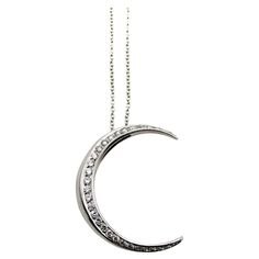 This is part of Chairish’s Fine Jewelry assortment.  This 18k white gold crescent moon necklace is encrusted with sparkling diamonds. The crescent moon has a rounded shape, with wonderful dimension—when it hangs from the chain it has depth that draws the eye to this excellent piece. Circa 1980’s, this vintage necklace is Italian made. It provides a great contrast when paired with yellow gold, offering a nice cool pop, as if glowing “by the light of the silvery moon.”   There are 29 single cut di Luxury White Crescent-shaped Jewelry, Gold Crescent Moon Necklace, Crescent Moon Necklace Gold, Gold Crescent Moon, Crescent Moon Necklace, Modern Necklaces, Moon Necklace, Sparkle Diamonds, Contemporary Fashion