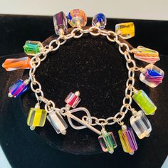 This Beautiful, Sparkling Charm Bracelet Has Multicolored Charms Of Furnace Glass And Sterling Silver Beads. Charms Are Set On A Sterling Silver Chain Link Bracelet With A Sterling Silver Toggle Clasp. The Happy Colors Glitter Prettily In The Light! Dress It Up With A Silver Bracelet Of Your Own Or Just Let It Dress Up Your Mood! A Free Pair Of Matching Earrings Will Be Chosen To Match The Bracelet! 4 Available With Differing, But Similar Glass Pieces. One 7” In Length Three 7 1/2” In Length Lava Rock Jewelry, Fork Bracelet, Red Beaded Bracelet, Cowgirl Bling, White Pearl Bracelet, Cluster Bracelets, Turquoise Bead Bracelet, Rock Jewelry, Light Dress