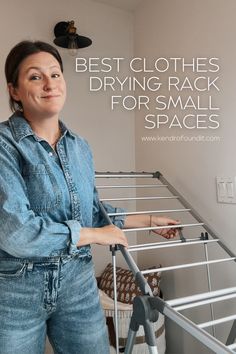 a woman standing next to a metal bed frame with the words best clothes drying rack for small spaces