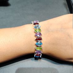 "This Listing is For-: Natural Multi Color Stone Bracelet, Sterling Silver Tennis Bracelet, Multi Color Bracelet Gift For Her, Mothers Day Gift Anniversary Gift METAL --- 925 STERLING SILVER PRODUCTS TYPE --- BRACELET STONE DIMENSION --- 5x10 MM STONE WEIGHT --- 20.50 CTS. TOTAL WEIGHT --- 11.170 GRAMS Bst- 309-MT ✔ \"Important Note: As we used natural gemstones so gemstone color may sometimes vary.\" Shipping Policy :- * Shipping Thru FedEx, DHL Express, USPS & Other Courier Services. * We also Oval Sterling Silver Bracelets With Multi-stone, Oval Sterling Silver Bracelet With Gemstone For Anniversary, Sterling Silver Oval Gemstone Bracelet For Anniversary, Silver Multi-stone Tennis Bracelet, Sterling Silver Multicolor Bracelets For Anniversary, Multicolor Sterling Silver Bracelet For Anniversary, Multicolor Sterling Silver Anniversary Bracelet, Formal Multicolor Sterling Silver Bracelets, Gemstone Bangle Bracelets