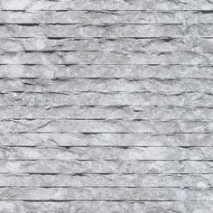 a gray stone wall textured with thin lines