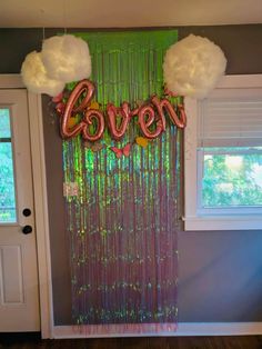 balloons are hanging on the wall in front of a door that says,'haven '