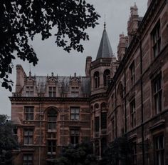 an old building with many windows and towers