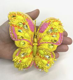 A stunning Yellow Hand Embroidered Butterfly Brooch, that is simply a work of art. The kind that cannot be found in stores. It is hand produced in our studio by an amazing Emboider-sculptor whose work is museum quality. Extra large in size ( 6.3 inches length) it is a work of art that will instantly upgrade and upscale every look to a hole different dimension. Super chic, super smart, super elegant and luxurious, this unique brooch is a rare find for those who appreciate excellence and majestic Hand Embroidered Butterfly, Beaded Butterflies, Leather Face Mask, Jewelry Butterfly, Gold Bubbles, Unique Brooch, Embroidered Butterfly, Butterfly Pin, Beautiful Belts