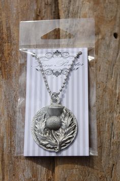 This is our hand cast, lead-free fine pewter Thistle Necklace on a 24 inch stainless steel military ball chain. The pewter pendant measures approximately 1 1/2 inches in diameter. It is hand cast/made in Michigan! It will be attached to our card enclosed in a clear package and would make a great gift! If you would like more quantity than what we have listed, please ask. We usually have more in stock OR we can let you know how long before we would have the quantity you need. You can add more pewt Thistle Necklace, Military Ball, Dragon Figurines, Pewter Pendant, Keychain Gift, Hand Cast, Chain Pendant, Ball Chain, Just Amazing