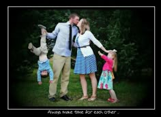 an adult and two children are standing in the grass