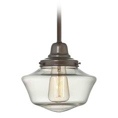 a small glass light fixture hanging from a ceiling mounted pendant lamp in an antique bronze finish