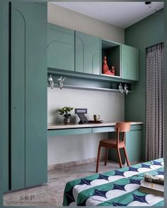 a bedroom with green cabinets and a desk