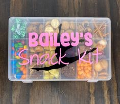 a plastic container filled with assorted snacks