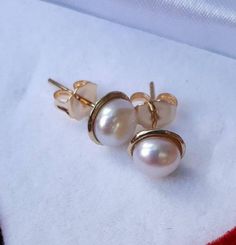 **FREE EXPRESS SHIPPING** A beautiful white pearls in gold stud earrings A delicate studs for the bride Or a special gift for you Can be ordered with different pearl color Earring Size: 7.5 mm Pearl size: 6 mm The earrings is from 14k gold solid The earrings is custom made especially for you Please give us 3-5 working days to make, pack and send it to you Bridal Stud Earrings, Bridal Earrings Studs, Studs Gold, Stud Earrings Gold, Gold Stud Earrings, Earrings Pearl, Silver Engagement Rings, Long Pendant, Amethyst Necklace