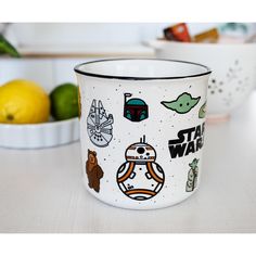 a star wars themed coffee mug sitting on top of a counter