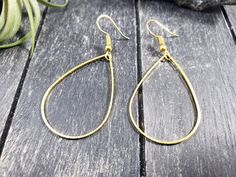 "These super lightweight teardrop hoop earrings feature 40mm x 26mm brass open teardrops. Choose silver-plated or gold-plated! These minimalist geometric earrings will complement any outfit, and are lightweight enough for all day wear! The earrings measure 2.5 inches from the bottom of the teardrop to the top of the ear wires. The gold earrings have hypoallergenic gold-plated surgical steel ear wires, while the silver earrings have hypoallergenic surgical steel ear wires. These earrings are incr Everyday Metal Teardrop Earrings, Metal Drop Hoop Earrings With Ear Wire, Adjustable Hypoallergenic Teardrop Hoop Earrings, Metal Teardrop Drop Earrings, Handmade Teardrop Earrings, Everyday Earrings Simple, Gold Teardrop Earrings, Teardrop Earrings Gold, Teardrop Hoop Earrings