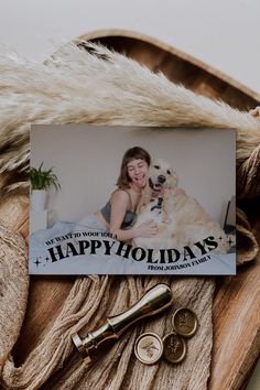 a card with a photo of a woman and her dog on it next to some keys