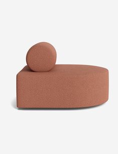 an object that looks like a couch with a ball on the back and one end