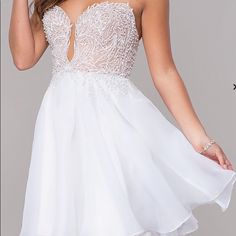 Embroidered-Bodice Short Strapless Homecoming Dress Details Closure: Back Zipper, Hook And Eye Details: Embroidery, Pearl Beads, Illusion, Rolled Hem, Bra Cups Fabric: Self: 100% Polyester, Organza Lining: 100% Polyester, Satin Fit: The Model Is 5'9.5". Length: Dress 29" Hollow To Hem 32" Neckline: Strapless Sweetheart Waistline: Natural Never Worn. Brand New With Tags. Retails For $140 White Embellished Mini Dress With Sweetheart Neckline, White Strapless Dress With Sweetheart Neckline For Homecoming, White Strapless Embellished Dress, White Embellished Strapless Dress, White V-neck Homecoming Dress, White Embroidered Mini Dress For Party, White Embellished Strapless Dress For Wedding, White Embellished Strapless Wedding Dress, White Strapless Dress For Homecoming