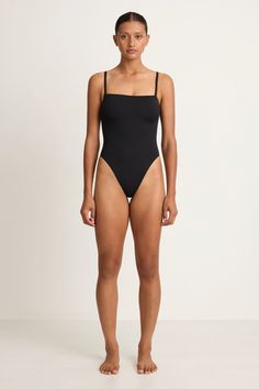 This popular one piece is sleek and minimal with a square neckline, high cut leg and internal bra for added support. Adjustable straps. Chic Black Swimwear With Square Neck, Chic Black Square Neck Swimwear, Black Swimwear With Adjustable Straps And Minimal Stretch, Black Square Neck Stretch Swimwear, Black Spaghetti Straps Swimwear, Sleek Swimwear With Adjustable Straps, Elegant Black High-cut Leg Swimwear, Sleek Spaghetti Strap Bodysuit For Swimming, Sleek Second-skin Bodysuit With Adjustable Straps