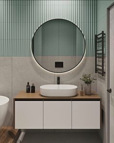 a bathroom with a large round mirror above the sink