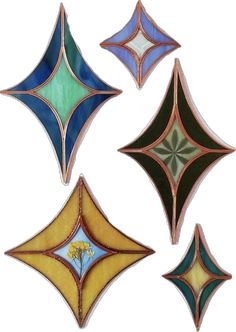 four different colored glass designs on a white background