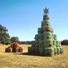 a large christmas tree made out of hay bales