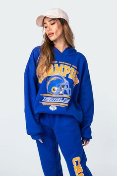 Get the oversized look with this champion graphic hoodie. This cozy drop shoulder sweatshirt is constructed from a soft flock fabric and features ribbed cuffed sleeves to lock in the warmth. Blue Sweats For Streetwear During Sports Season, Blue Graphic Print Sportswear Hoodie, Blue Sportswear Sweats For Fall, Blue Hooded Hoodie For Sports Season, Blue Sweats For Streetwear In Fall, Blue Sweats With Drawstring Hood For Fall, Blue Sweats For Fall Streetwear, Blue Hooded Hoodie For Sports Events, Blue Fall Sweats With Drawstring Hood