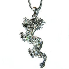 PERFECT CHRISTMAS GIFT / CHINESE NEW YEAR GIFT FOR MAN / LADY !! You are getting a Classy, Magical DRAGON & CRYSTAL AB Spiritual BALL in the mouth Pendant with Swarovski crystals. It comes with a FREE 18" inches (45cm) silver finish snake necklace with lobster clasp.  The chain is removable, so you can put any chain, leather cord or rubber cord through the pendant. Pendant size is 7/8"(2.3cm) wide X 1 7/8" (4.5cm) high.Crystal Color:  Aurora Borealis, Crystal Clear, Jet Black =================== Gift Crystal Rhinestone Necklace With Sparkling Stones, Gift Rhinestone Crystal Necklace With Sparkling Stones, Sparkling Crystal Rhinestone Necklace Gift, Crystal Pendant Rhinestone Necklace As Gift, Crystal Rhinestone Pendant Necklace Gift, Sterling Silver Rhinestone Necklace For Gift, Silver Sparkling Rhinestone Necklace For Gift, Crystal Necklaces With Sparkling Stones For Gift, Crystal Necklace With Sparkling Stones For Gift