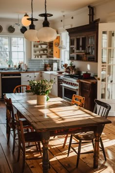 a wooden table sitting in the middle of a kitchen