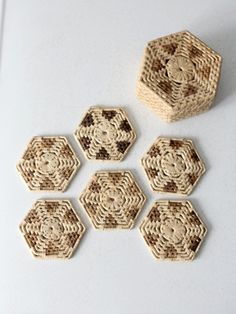 six small wooden hexagonals sitting next to each other on a white surface