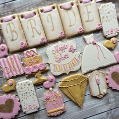 decorated cookies are arranged on a table for a bride's day party or bridal