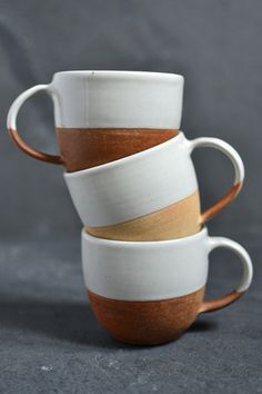 three coffee cups stacked on top of each other