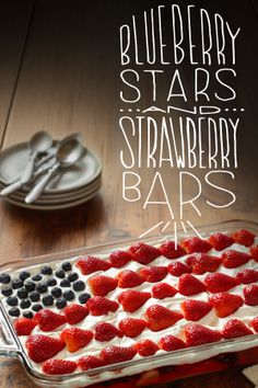 an american flag cake with strawberries and blueberries in it on a wooden table