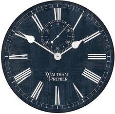 a black clock with roman numerals and the words william cremer on it