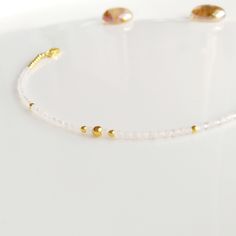 "Minimalist, wearable and delicate rose quartz and 14k gold filled beaded bracelet for everyday wearing. Length: from 5,5\" to 8\" with 2\" 14k gold filled extensor chain. Width: 2 mm 14k gold filled beads and rose quartz beads. Material: 14k gold filled strong lobster clasp. Handmade in Spain. ✩ Please kindly note that these stones are natural so they can vary slightly in color from the one on the pics. They can also contain some inclusions. ✩ Ideal for a gift to gold jewelry lovers. All our pr Delicate Gemstone Beaded Bracelets, Minimalist 14k Gold Filled Beaded Bracelets, Delicate Gold Bracelets With Gemstone Beads, Gold Minimalist Crystal Bracelet With Round Beads, Handmade Dainty Rose Quartz Beaded Bracelets, Delicate Gold Bracelet With Gemstone Beads, Dainty White Rose Quartz Jewelry, Handmade Minimalist Crystal Bracelet, Dainty Rose Gold Beaded Bracelets With Rose Quartz