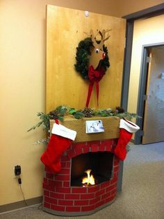 a fire place with a christmas wreath on top