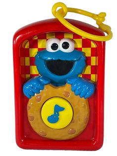 the sesame street cookie monster playset is red and yellow with checkered pattern on it