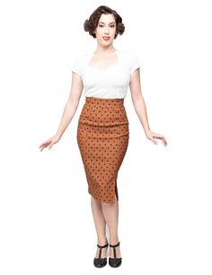 This eye catching polka dot pencil skirt will not only have you stand out in a crowd, but is form fitting and perfect for your lovely curves. It's great for a casual day or a night out and super versatile! Available in red and mint. It is made from a mixture of Rayon, Nylon, and Spandex for stretch and comfort. COLOR:Rust brown with black polka dots MATERIAL:79% Rayon, 17% Nylon, 4% SpandexMachine WashableMade in the USA 50s Pencil Skirt, Rocker Chic Style, The 50s Fashion, Black Flare Skirt, Polka Dot Pencil Skirt, Rock Steady, Women's Bottoms, Rocker Chic, Vintage Inspired Outfits