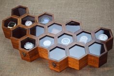 a wooden box that has several compartments in it