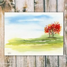 a watercolor painting of a red tree on a wooden fence