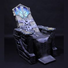 a chair that is made out of some kind of material and has an intricate design on it