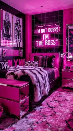 a bedroom with pink lighting and pictures on the wall